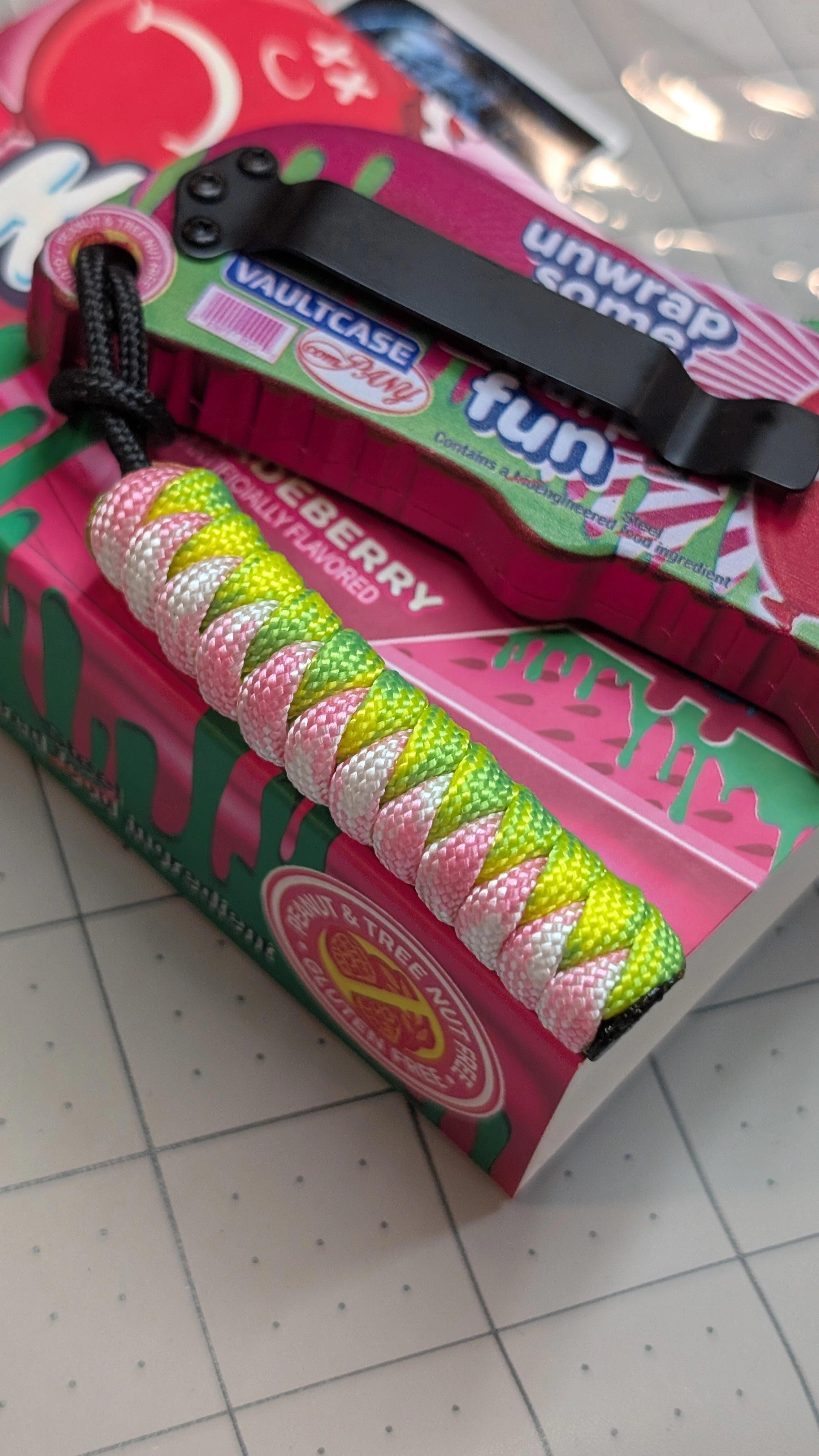 Frozen State Cords paracord lanyard, neon pink and yellow, Sour Patch Knife Utility Blade edition, close up